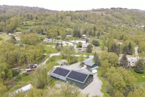 An aerial view of the Bear Creek Winery bottling works facility is seen in this June 2022 photograph after installation of the solar panel system by Midnight Sun Solar, LLC in Homer, Alaska. Photo provided by Alexander Sievers