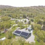 An aerial view of the Bear Creek Winery bottling works facility is seen in this June 2022 photograph after installation of the solar panel system by Midnight Sun Solar, LLC in Homer, Alaska. Photo provided by Alexander Sievers