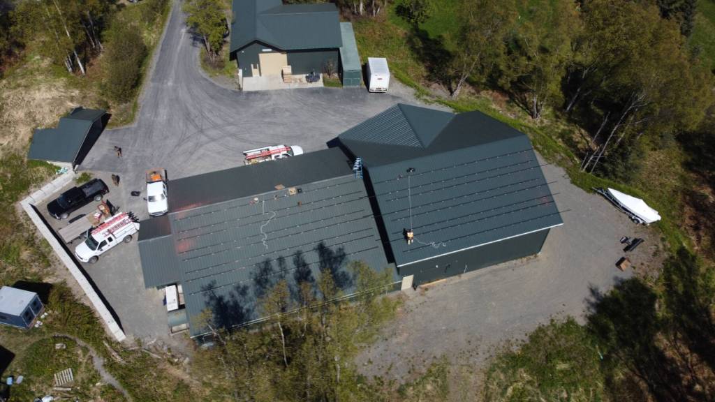 Midnight Sun Solar, LLC installs the solar array on the roof of Bear Creek Winerys bottling works facility in June 2022. Photo provided by Alexander Sievers