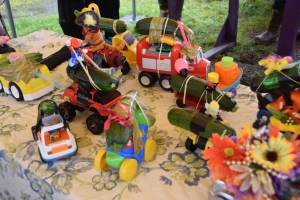 Zucchini cars crafted by participating kids are ready to race at the Homer Farmers Market Zucchini Festival on Saturday, Aug. 26, 2023 in Homer, Alaska. (Delcenia Cosman/Homer News)