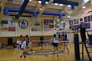 Sitka blocks a serve from Homer opposite hitter Alivia Fefelov (right) at the varsity nonconference game on Thursday, Aug. 24, 2023 in Homer, Alaska. (Emilie Springer/Homer News)