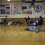 A Homer player spikes the ball over the net at the varsity conference game against Seward on Friday, Aug. 25, 2023 in Homer, Alaska. (Emilie Springer/Homer News)