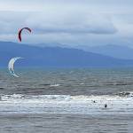 Adventurous kitesurfers brave the cold waters of Kachemak Bay next to the Spit on Saturday, Sept. 2, 2023 in Homer, Alaska. (Delcenia Cosman/Homer News)