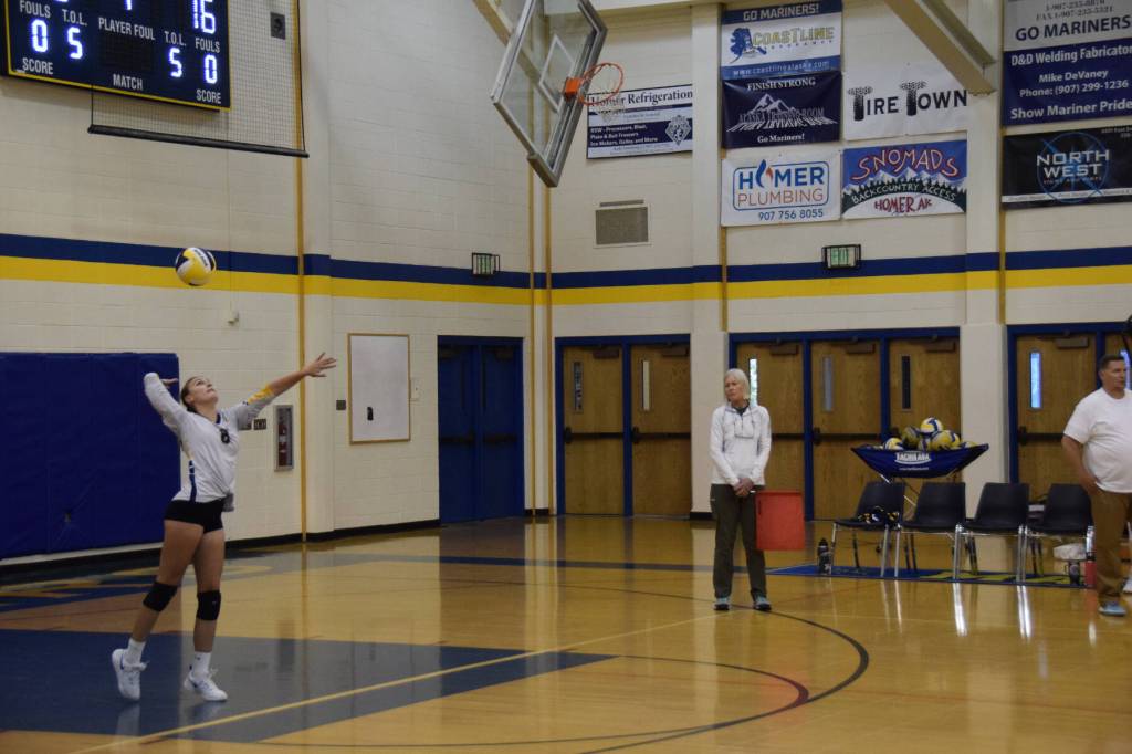 Middle blocker Goldie Hill serves the ball at the varsity game versus Soldotna on Friday, Sept. 1, 2023 in Homer, Alaska. (Delcenia Cosman/Homer News)