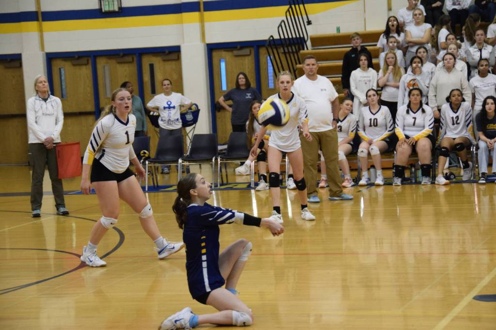 Outside hitter Regan Baker digs the ball in the fifth set of the varsity game versus Soldotna on Friday, Sept. 1, 2023 in Homer, Alaska. (Delcenia Cosman/Homer News)