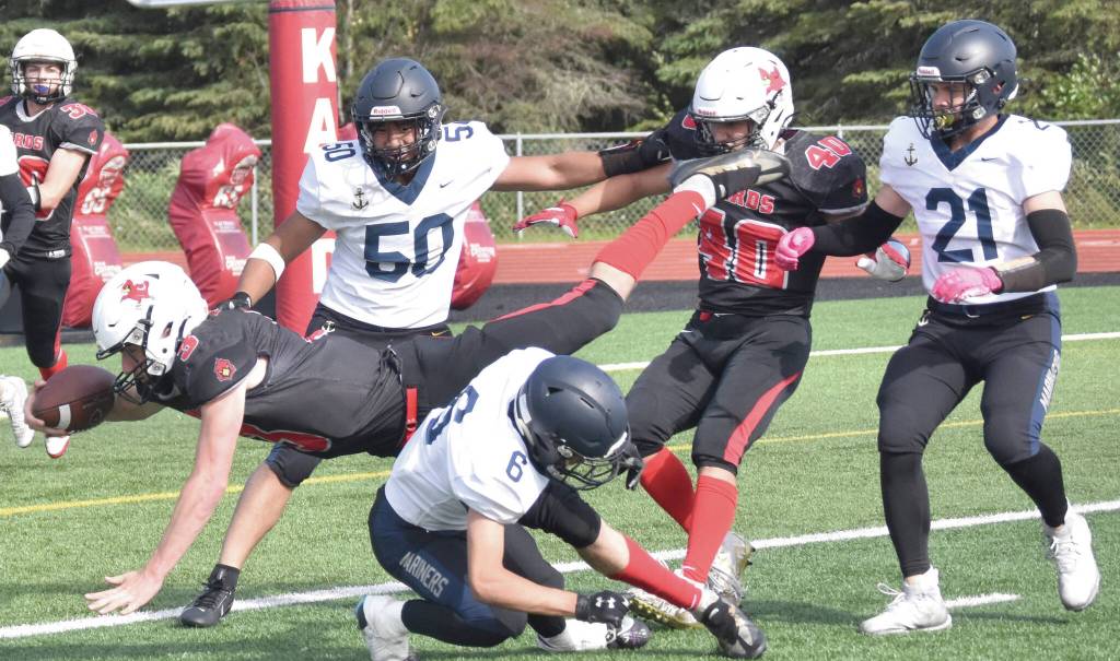 Photo by Jeff Helminiak/Peninsula Clarion
Homers Austin Briscoe tackles Kenai Centrals Zeke Yragui just short of the end zone Saturday at Ed Hollier Field at Kenai Central High School in Kenai.