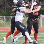 Kenai Centrals Sawyer Vann and Zeke Yragui break up a pass intended for Homers Chris Martishev on Saturday, Sept. 2, 2023, at Ed Hollier Field at Kenai Central High School in Kenai, Alaska. (Photo by Jeff Helminiak/Peninsula Clarion)