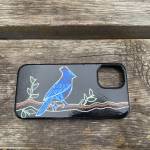 A cell phone case shows a commissioned painting of a blue jay by Daisy Walker in the summer of 2023. Photo provided by Daisy Walker