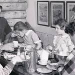 The Lancashire family shares a meal in their original homestead cabin. (1954 photo by Bob and Ira Spring for Better Homes & Garden magazine)