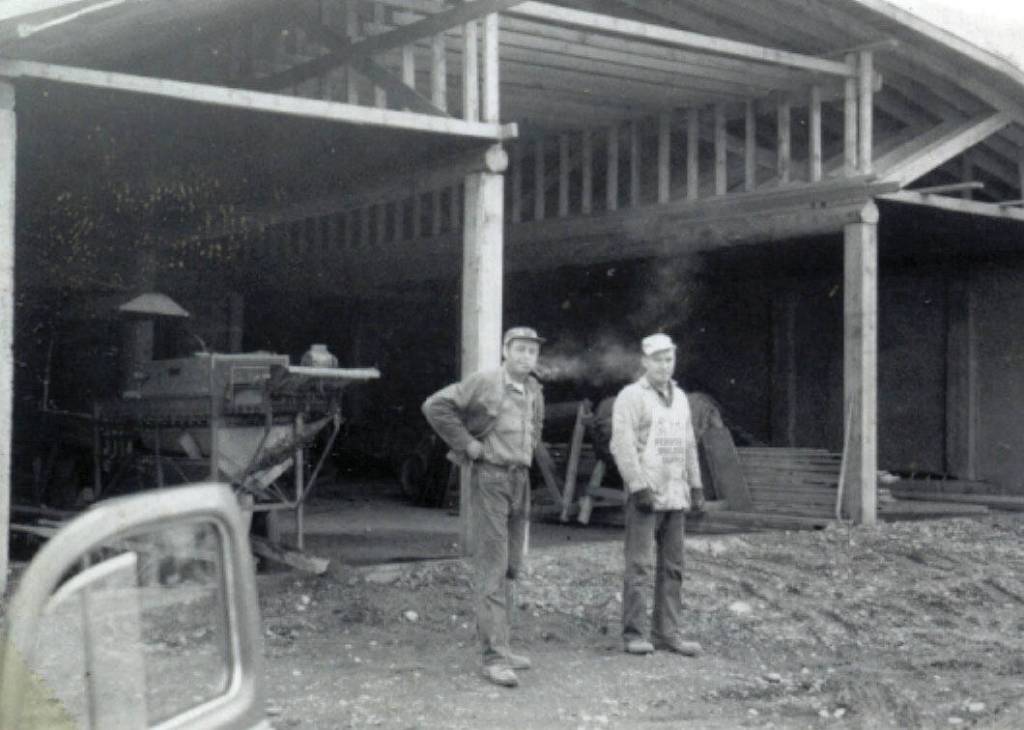 Cheechako News photo courtesy of the KPC historic photo repository
Larry Lancashire, left with his pipe, and his helper Charles Easton, pause during the construction of Lancashires potato barn in 1961.