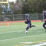 Jonah Martin (center) runs for a touchdown at the homecoming game versus Palmer on Friday, Sept. 8, 2023 in Homer, Alaska. (Delcenia Cosman/Homer News)