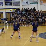Addison Grimes (left) digs the ball at the varsity game against the Kenai Kardinals on Saturday, Sept. 9, 2023 in the Alice Witte Gymnasium at Homer High School in Homer, Alaska. (Delcenia Cosman/Homer News)