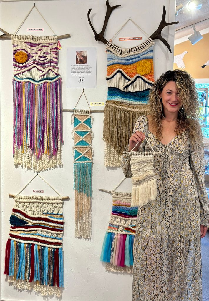 Artist Chelsea Carpenter poses with her macraweave art, now available year-round at Ptarmigan Arts, on Thursday, Sept. 7, 2023 in Homer, Alaska. Photo by Christina Whiting