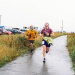 Homer Volunteer Fire Department firefighter and EMT Jaclyn Arndt (right) approaches the finish line at the 5K Run for Recovery on the Homer Spit on Saturday, Sept. 16, 2023 in Homer, Alaska. Arndt was awarded a prize for First Place Adult Woman in the ceremony following the race. Photo by Arctic Stills Photography