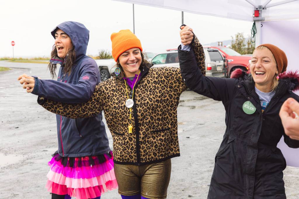 (from left to right) Mallory Primm, Drue Smith and Annie Garay of the Sealegs Stilt Troupe celebrate winning "Most Creative/Most Colorful" at the 5K Run for Recovery on Saturday, Sept. 16, 2023 on the Spit in Homer, Alaska. Photo by Arctic Stills Photography