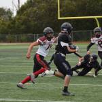 Homers Jake Tappan makes a 18-yard run during the varsity game against the Houston Hawks on Saturday, Sept. 16, 2023 in Homer, Alaska. (Delcenia Cosman/Homer News)
