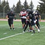 Homer running back Jake Tappan fights to take the ball to the five-yard line in the second half of the varsity game against the Houston Hawks on Saturday, Sept. 16, 2023 in Homer, Alaska. (Delcenia Cosman/Homer News)
