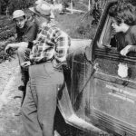 1954 photo by Bob and Ira Spring for Better Homes & Garden magazine
Larry Lancashire (far left) chats with a representative from the Department of Agricultures Soil Conservation Service, as daughter Abby listens in.