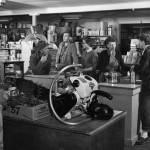 1954 photo by Bob and Ira Spring for Better Homes & Garden magazine
Rusty Lancashire (far right) chats with Helen Jones inside a busy Kenai Commercial Company store.