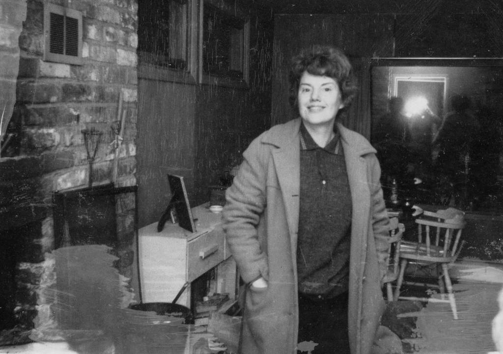 Photo courtesy of the Lancashire Family Collection
Rusty Lancashire smiles for the camera in the frame house that in the late 1950s replaced the Lancashires original homestead log cabin.