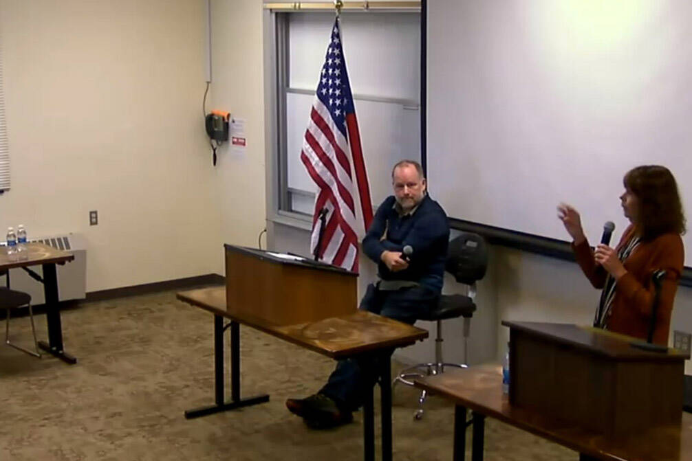 Kelly Cooper (right) answers a question from moderator and Homer Chamber of Commerce board of directors president Michael Daniel (left) during the Kenai Peninsual Borough Assembly candidate forum with Cooper and Heath Smith (center) on Wednesday, Sept. 20, 2023 at Kachemak Bay Campus in Homer, Alaska. Screenshot.