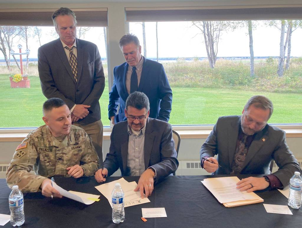 Clockwise from bottom left: U.S. Army Corps of Engineers Alaska Division Commander Col. Jeff Palazzini, Gov. Mike Dunleavy, Kenai Mayor Brian Gabriel, Kenai City Manager Terry Eubank and Assistant Secretary of the Army for Civil Works Michael Connor participate in a signing ceremony for a project partnership agreement for the Kenai Bluff Stabilization Project at the Kenai Senior Center on Monday, Sept. 25, 2023, in Kenai, Alaska. (Jeff Helminiak/Peninsula Clarion)