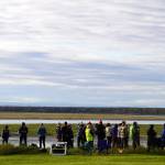 Attendees search the waters of the Kenai River for sightings of Cook Inlet belugas during Belugas Count! at the Kenai Bluff Overlook in Kenai, Alaska on Saturday, Sept. 23, 2023. (Jake Dye/Peninsula Clarion)