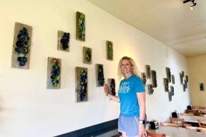 Artist Krista Etzwiler hangs her ceramic pinch pots on reclaimed wood at The Bagel Shop on East End Road in August in Homer, Alaska. Photo provided by Krista Etzwiler