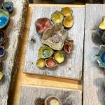 Ceramic pinch pots on reclaimed wood created by Homer artist Krista Etzwiler are on display at The Bagel Shop out East End Road through October in Homer, Alaska. (Photo provided)