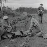 Rusty Lancashire (standing) and two of her daughters work to harvest vegetables from their large homestead garden. (1954 photo by Bob and Ira Spring for Better Homes & Garden magazine)