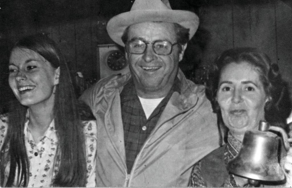 Larry Lancashire (center) smiles and poses with two unidentified women in Larrys Club, the restaurant/bar owned by Larry and Rusty Lancashire, starting in late 1964. (Cheechako News photo courtesy of the KPC historic photo repository)