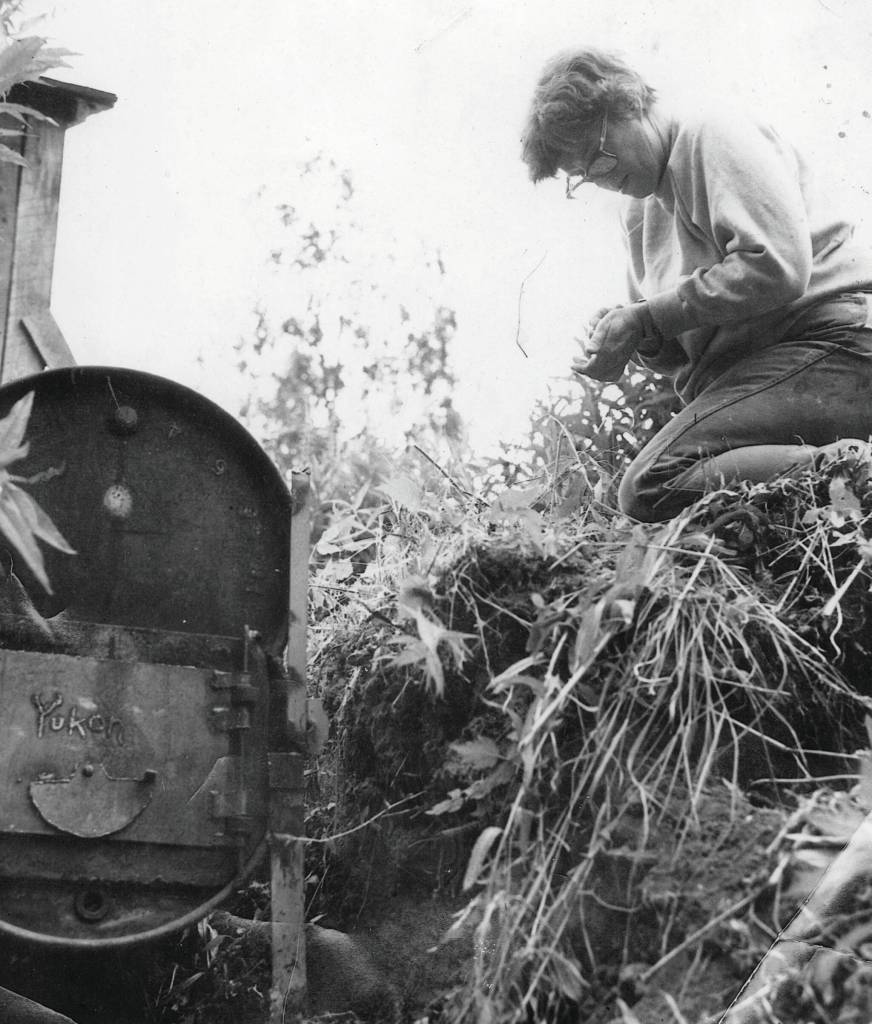 Photo courtesy of the Lancashire Family Collection
Rusty Lancashire, in this circa-1970s image, prepares to fire up the familys old Yukon stove in order to smoke some salmon.
