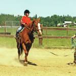 Clark Fair photo from 2001
For many years, Abby (Lancashire) Ala (standing) gave horseback riding lessons at her home, the site of her longtime business, Ridgeway Farms.