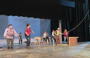 Emilie Springer/ Homer News
Mariners take in the topsail on Sunday before Pier Ones opening of Shakespeares The Tempest. The performance opens Friday, 7 p.m. at the Mariner Theater.
