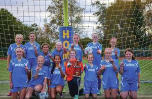 Homer Husky girls soccer take season trophy on Sunday, Oct. 1 at the Homer Mariner field. (Photo provided by Christopher Kincaid)