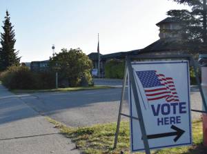 Vote Here sign directs voters to the voting station at Homer City Hall on Tuesday, Oct. 3, 2023, election day. (Finn Heimbold/ Homer News)