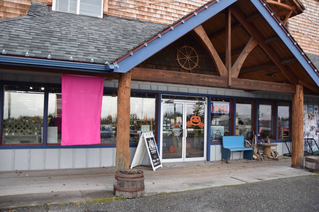 A pink flag hangs outside NOMAR in recognition of October as Breast Cancer Awareness Month on Saturday, Oct. 7, 2023 in Homer, Alaska. (Finn Heimbold/Homer News)