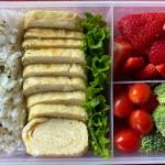 This bento box includes rice, fruit, vegetables and tomagoyaki, or Japanese rolled omelet. (Photo by Tressa Dale/Peninsula Clarion)