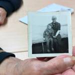 Mary Lou Bottorff, a survivor of Holy Cross Mission, holds a picture taken of her en route to Holy Cross Mission taken in Nome in 1948, when she was eight years old, inside the Tyotkas Elder Center on Wednesday, Oct. 4, 2023 in Kenai, Alaska. (Ashlyn O'Hara/Peninsula Clarion)