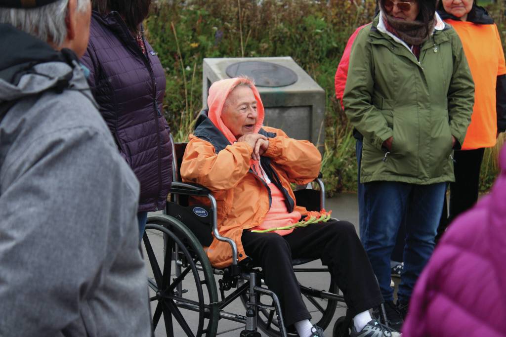 Ashlyn OHara/Peninsula Clarion
Mary Lou Bottorff, a survivor of Holy Cross Mission, speaks about her experiences during an Orange Shirt Day ceremony at Ggugguyni Tuh, Raven Place, outside the Denaina Wellness Center on Oct. 6 in Kenai. Orange Shirt Day honors indigenous elders who survived and children lost from boarding schools established to detribalize indigenous people.