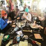 Carley Conemac provides instruction to community members attending her intermediate silversmithing workshop at Divinitea in April 2022. Photo by Serrena Bennet