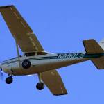 A plane flies overhead during Kenai Aviations Fifth Annual Pumpkin Drop at the Kenai Airpark in Kenai, Alaska, on Saturday, Oct. 21, 2023. (Jake Dye/Peninsula Clarion)