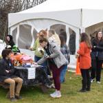 Community members vote for their favorite carved pumpkin at the Fall Fest at the Homer Chamber of Commerce on Saturday, Oct. 28, 2023 in Homer, Alaska. (Delcenia Cosman/Homer News)