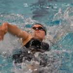 Homers Cassidy Carroll takes second in the 100-yard backstroke Saturday, Oct. 28, 2023, at the Northern Lights Conference swim meet at Soldotna High School in Soldotna, Alaska. (Photo by Jeff Helminiak/Peninsula Clarion)