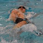 Sewards Nickolas Ambrosiani swims to victory in the 100-yard backstroke Saturday, Oct. 28, 2023, at the Northern Lights Conference swim meet at Soldotna High School in Soldotna, Alaska. (Photo by Jeff Helminiak/Peninsula Clarion)