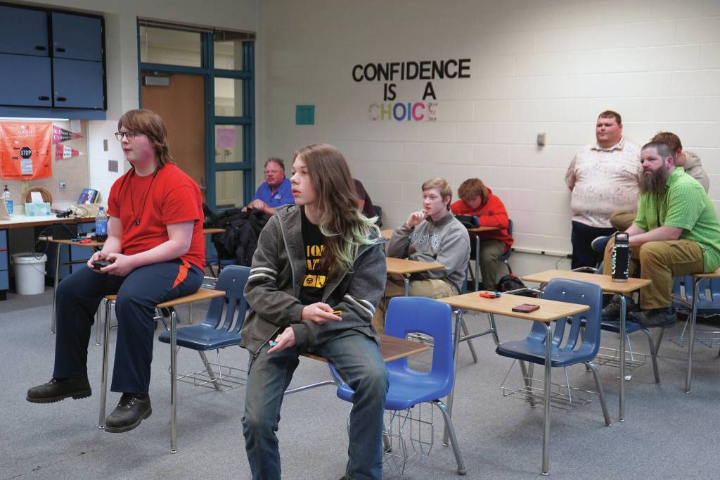 Players, coaches and parents watch as Kenais Boyd Lehmberg and Nikiskis Lincoln Kimbell play the final round of competition for a Super Smash Bros. Ultimate match at Nikiski Middle/High School on Oct. 23. (Jake Dye/Peninsula Clarion)