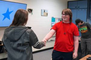 Lincoln Kimbell shakes hands with Boyd Lehmberg after winning the final round of a Super Smash Bros. Ultimate match at Nikiski Middle/High School in Nikiski, Alaska, on Monday, Oct. 23, 2023. (Jake Dye/Peninsula Clarion)