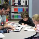 Hope School K-5 teacher Jeremy McKibben assists third grade students with reading skills part of CKLAs How Does Your Body Work? unit on Wednesday, Oct. 18, 2023, in Hope, Alaska. (Ashlyn OHara/Peninsula Clarion)