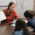 Jennifer Medley (left) practices literacy skills with students at Fireweed Academy on Tuesday, Oct. 17, 2023, in Homer, Alaska. (Ashlyn OHara/Peninsula Clarion)