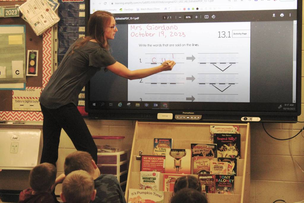 Mountain View Elementary School first grade teacher Callie Giordano leads her students in a literacy skills exercise on Thursday, Oct. 19, 2023, in Kenai, Alaska. (Ashlyn OHaara/Peninsula Clarion)